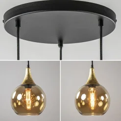 Straluma Ronde 3-lichts hanglamp zwart met goud en amber glas></noscript> Eettafellampen|Pendel Lampen